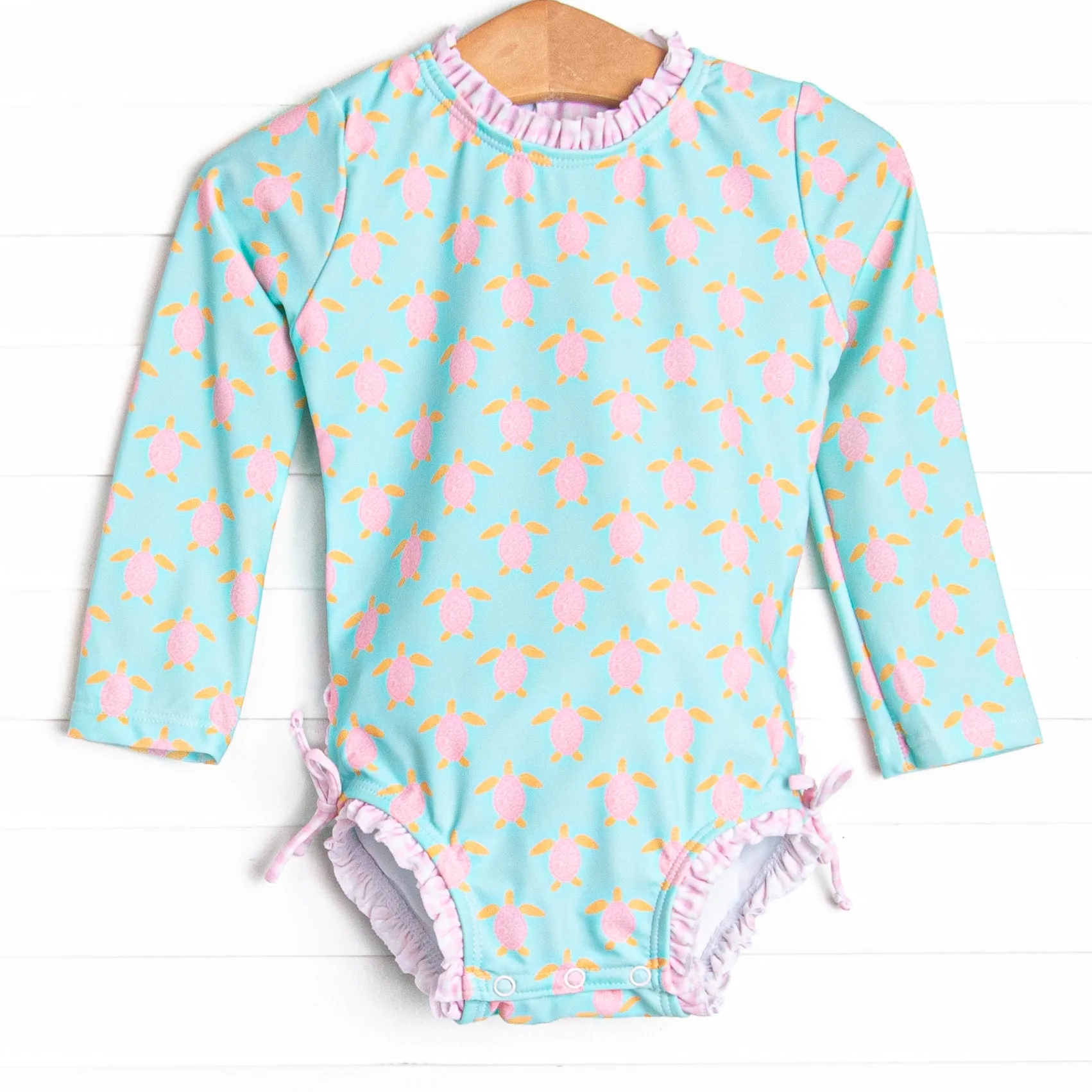Turquoise Turtles Long Sleeve One Piece Rash Guard, Pink